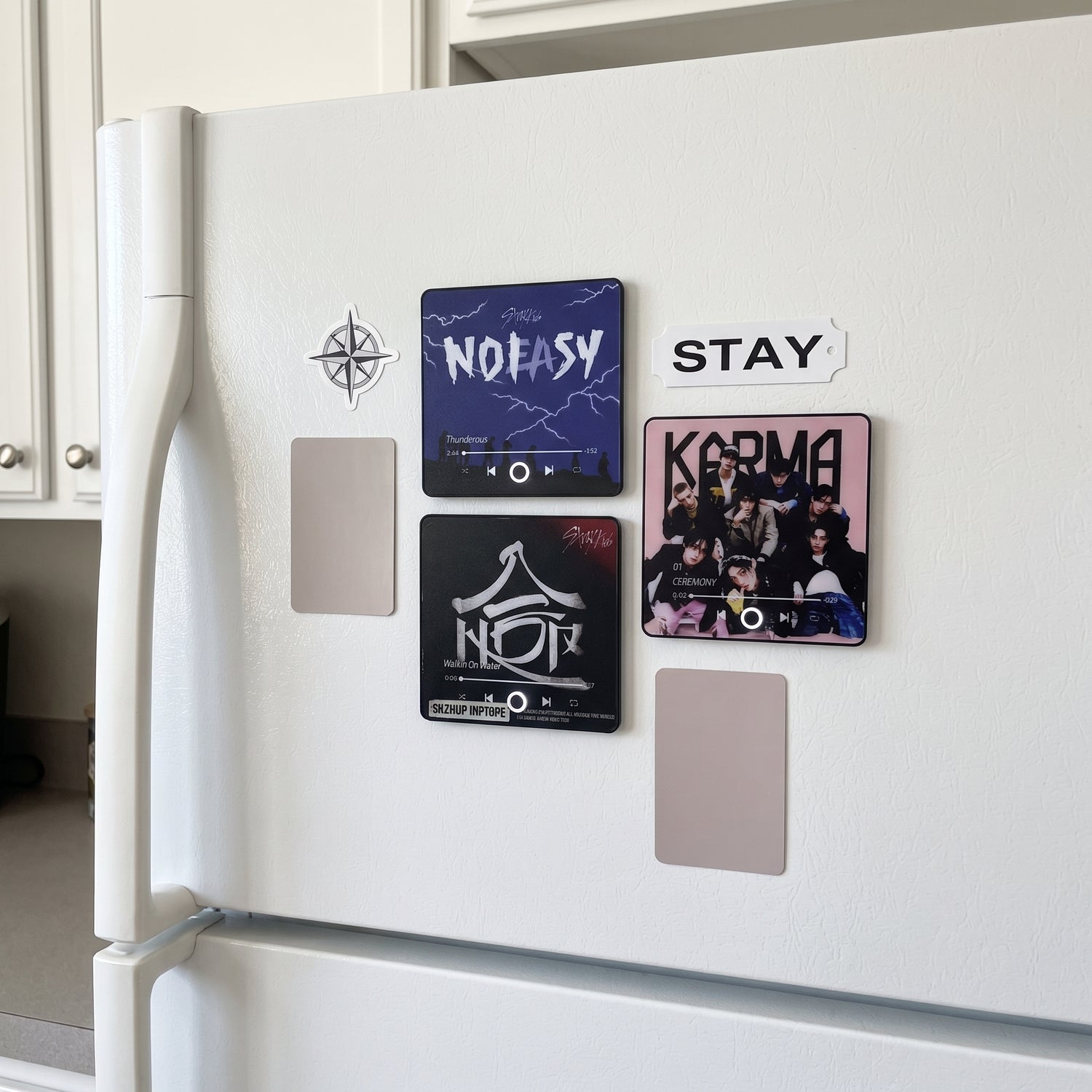 StayTunes magnets on a kitchen fridge door alongside a STAY nameplate